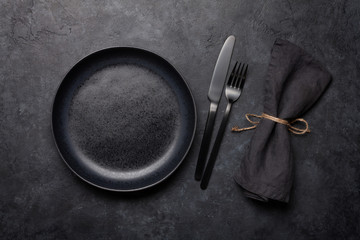 Empty plate, fork and knife