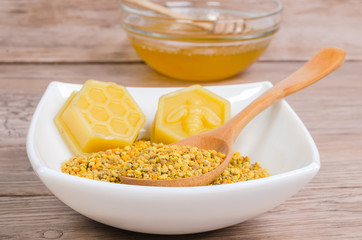 beeswax molds and pollen on white plate