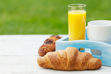 Coffee, orange juice and croissant
