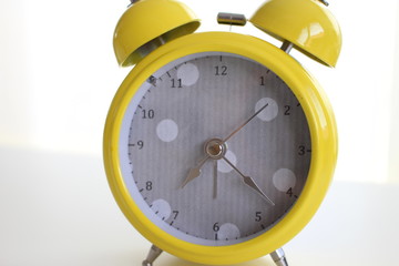 Yellow alarm clock with dots