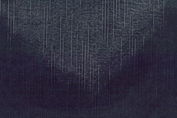 Image of dark denim cotton fabric texture with triangular stain