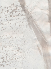 Abstract background, hand-painted texture, watercolor, splashes, drops of paint, paint strokes. The texture of stone, marble. Light monochrome color. Design for backgrounds, wallpapers, covers and pac