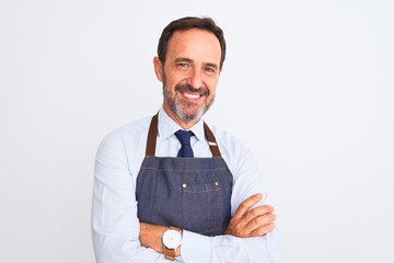 Middle age shopkeeper man wearing apron standing over isolated white background happy face smiling...