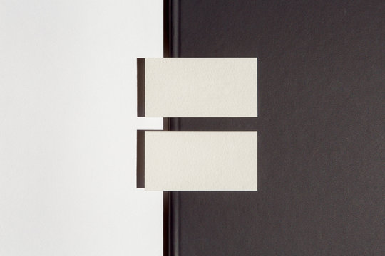 luxury paper business cards and folder on black and white background