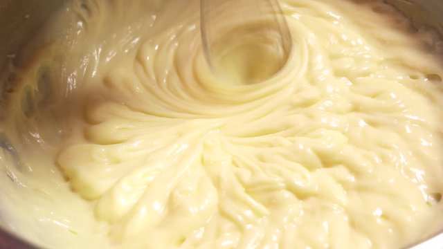 Mixing cream in bowl with motor mixer. Mixing dough in bowl with electric mixer. Whipped cream recipe.