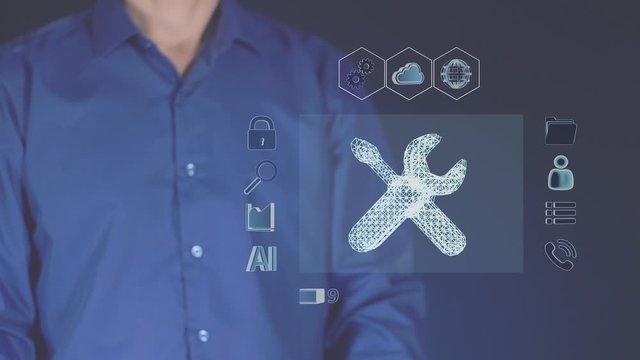 A virtual hologram of a futuristic symbol of repairs. Digital global technologies designed to help people. Abstract interface of a computer. Work in front of a modern network interface.