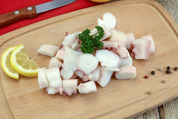 pieces of octopus cooked on a cutting board