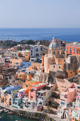 Panoramic view of beautiful Procida on a sunny summer day. Colorful cafes, houses and restaurants,...