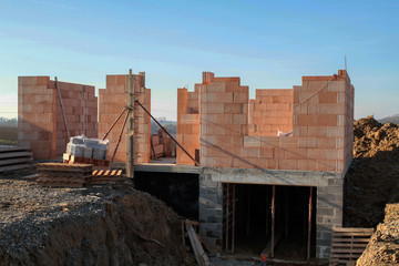 detached house under construction in a village