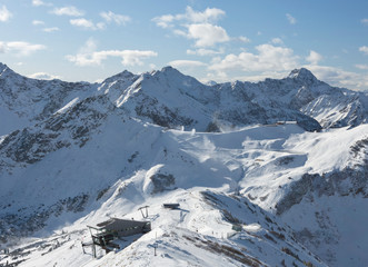 Fototapeta na wymiar Production of artificial snow in the Fellhorn-Kanzelwand ski area. Allgau Alps, Germany, Austria. Mass tourism, environmental destruction and resource consumption