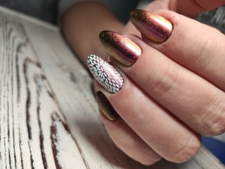 glamorous beautiful manicure on a trendy texture