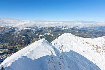 Snow-covered alpine landscape in the the Allgaeu Alps from summit of Fellhorn mountain at a beautiful early winter day. Bavaria, Germany