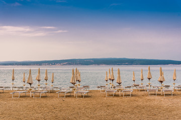Sunshades on the empty beach of Crikvenica in the early morning. Crikvenica is a popular holiday...
