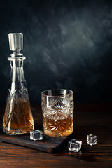 Obraz na płótnie Canvas Whiskey in glass with ice