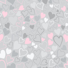 Romantic seamless pattern with cute images of hearts on a gray background. The style of children's drawing.