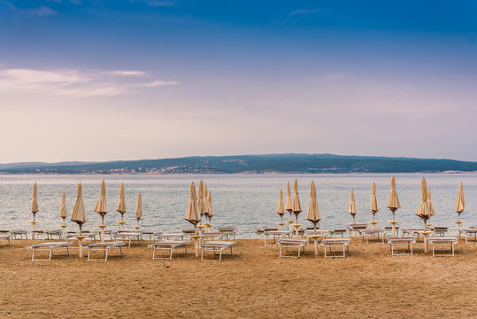 Sunshades on the empty beach of Crikvenica in the early morning. Crikvenica is a popular holiday resort in Croatia
