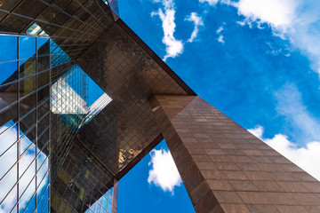 Detail of a modern glass mirror business building by London Bridge