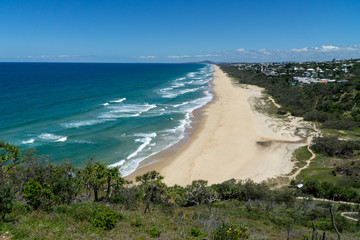 the beautiful beach of Noosa on the sunshine coast in Australia with beautiful weather and blue sky with white clouds © karegg