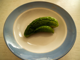 Non GMO cucumbers are healthy food, which contains lot of vitamins good for diet. Horizontal orientation Image. Siamese twins vegetables is strange plant.
