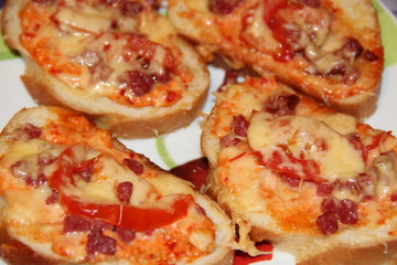 hot sandwiches with sausage and melted cheese