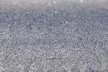 Texture of surface covered with hoar-frost in winter. Background with hoar-frost