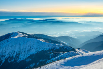 Mountain Peaks and Fog in the Valleys on a Winter Sunny Day