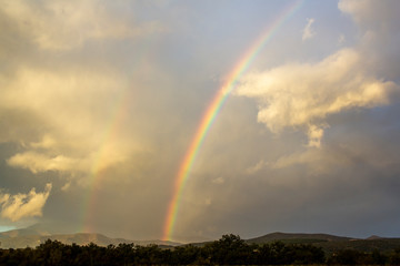 double rainbow on the hills