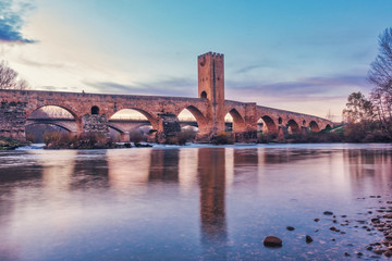 Fototapeta na wymiar Medieval fortified bridge over the river in Castilla y Leon, Spain.