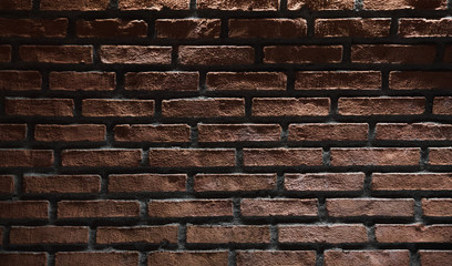 Dark red brick wall with top illumination effect