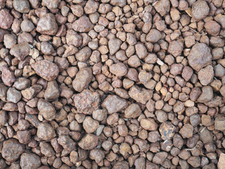Texture of brown pebbles stone  from waterfall.