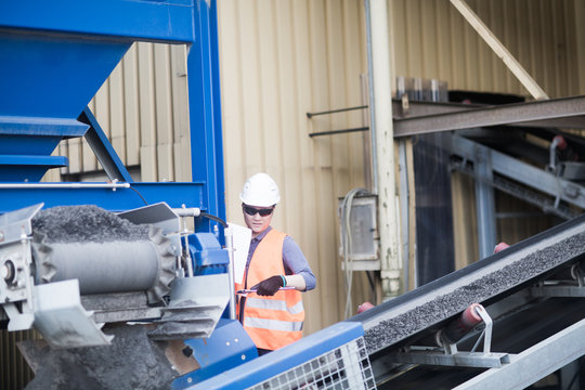 young worker in a concrete factory