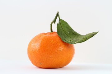 tangerine with leaves isolated on white background