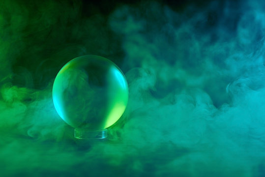 crystal ball in green-blue smoke