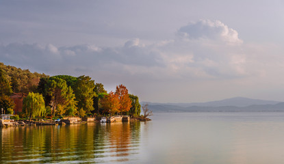Naklejka na ściany i meble Autumn view of Isola Maggiore (Greater Island) in Lake Trasimeno