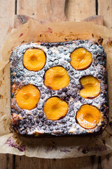 Blueberry apricot brownie cheesecake with icing sugar 