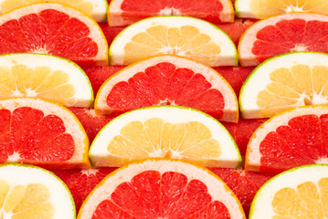 Naklejka na ściany i meble Pomelo and grapefruit slices background.