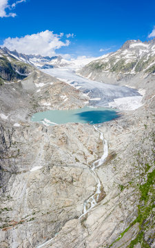 Aerial panoramic of Rhone Glacier and glacial lake at its base, Gletsch, Canton of Valais
