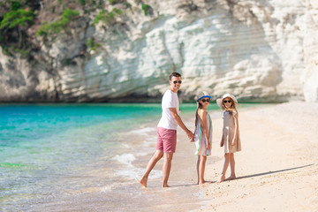 Father and kids enjoying beach summer vacation