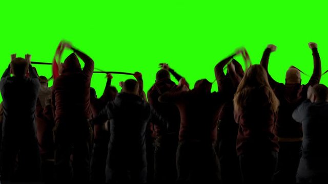 GREEN SCREEN CHROMA KEY Model released back view group of people fans wearing red clothes celebrating during a sport event. 4K UHD ProRes 422 HQ