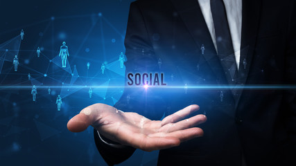 Fototapeta na wymiar Elegant hand holding SOCIAL inscription, social networking concept