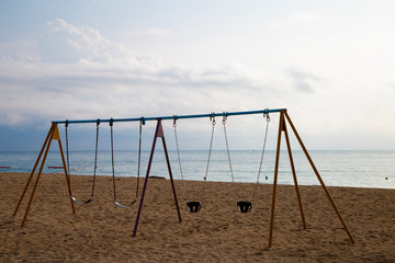 Swing on the beach by the ocean