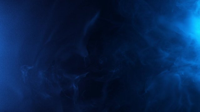 Slow motion of coloured smoke effect with neon lights. Filmed on high speed cinema camera 