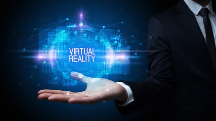 Man hand holding VIRTUAL REALITY inscription, technology concept