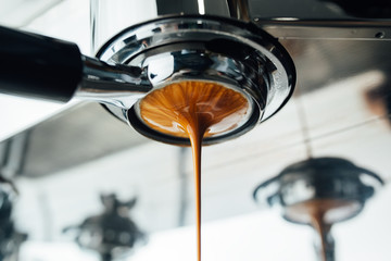 final stage of the espresso extraction process from bottomless portafilter