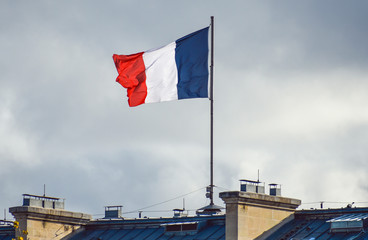 Flag of France waiving against sky on windy day