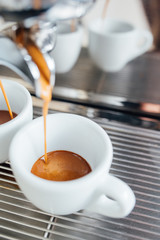 extraction of espresso from double open-end portafilter holder