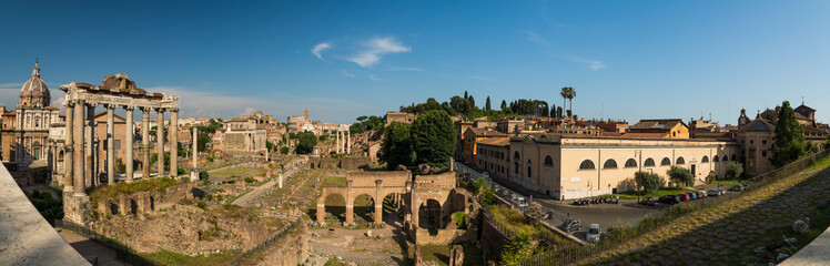 Fototapeta na wymiar Panoramic view of the antique ruins Roman forum view from the Capitoline Hill at summer sunny day in Rome in the province of Lazio, Italy