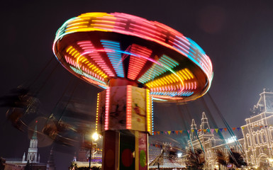Rotating carousel, long exposure carnival ride and Christmas market in Moscow