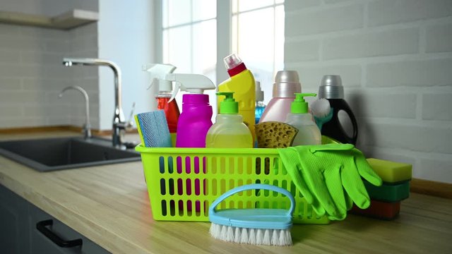 household chemicals standing in a basket in kitchen