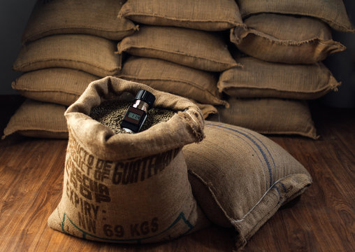 working device for measuring the humidity of coffee beans in a bag , in the background - Powered by Adobe